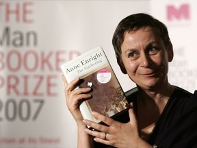 FILE - Irish writer Anne Enright holds a copy of her book after she won the Man Booker fiction prize for "The Gathering," an uncompromising portrait of a troubled family that its author called the literary equivalent of a Hollywood weepie, in London on Oct. 16 2007. Novels that give voice to the often unheard stories of migrants around the world are among the nominees for the 2024 Women's Prize for Fiction. The 16-book long list announced Tuesday, April 24, 2024, for the 30,000 pound ($38,000) award includes works by writers from Ghana, Barbados, Britain, the United States, Ireland, South Korea and Australia. One of the most published authors is Ireland's Anne Enright, nominated for her seventh novel, "The Wren, The Wren."