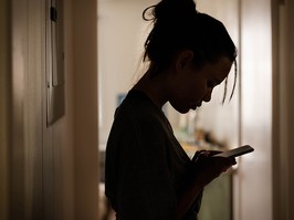 A teen using a phone