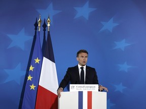 French President Emmanuel Macron speaks during a media conference at an EU summit in Brussels, Thursday, April 18, 2024. European Union leaders on Wednesday debated a new "European Competitiveness Deal" aimed at helping the 27-nation bloc close the gap with Chinese and American rivals amid fears the region's industries will otherwise be left behind for good.