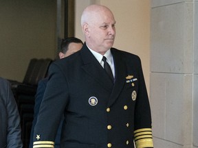FILE - Vice Chairman of the Joint Chiefs, Adm. Christopher Grady, right, arrives for a closed door briefing about the leaked highly classified military documents, on Capitol Hill, April 19, 2023, in Washington. Grady says there's been no final decision on whether or not all U.S. troops will leave Niger and Chad.