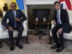 Britain's Prime Minister Rishi Sunak, right, and the President of Rwanda Paul Kagame pose for the media, ahead of their meeting inside 10 Downing Street in London, Tuesday, April 9, 2024.