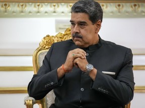 FILE - Venezuelan President Nicolás Maduro attends a meeting at Miraflores presidential palace in Caracas, Venezuela, Feb. 20, 2024. Maduro on April 16, 2024, ordered the closure of his country's embassy and consulates in Ecuador in solidarity with Mexico in its protest over a raid by Ecuadorian authorities on the Mexican embassy in Quito.