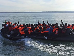 This photo provided by the Prefecture Maritime du Nord et de la Manche shows migrants continuing their journey to Britain off northern France coast, Tuesday, April 23, 2024. Five people, including a child, died while trying to cross the English Channel from France to the U.K., French authorities said Tuesday, just hours after the British government approved a migrant bill to deport some of those who entered the country illegally to Rwanda.(Prefecture Maritime du Nord et de la Manche via AP)