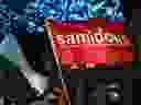 A photo shows a flag of the organization 'Samidoun' during a 
