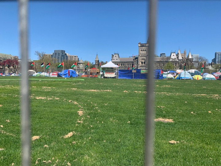  Signs adorn the fence surrounding King’s College Circle at the University of Toronto on May 7.