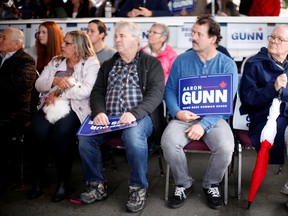 Supporters look on as B.C. Liberal Party candidate Aaron Gunn makes a speech to supporters from the Greek Community Centre during a campaign stop in Victoria, B.C., on Saturday, October 9, 2021.