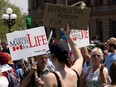 Protesters against abortion face-off with protesters for abortion as the two groups demonstrate on Parliament Hill, Thursday, May 11, 2023 in Ottawa.