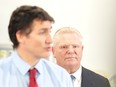 Prime Minister Justin Trudeau looks on as Ontario Premier Doug Ford responds to a question following an announcement in Ottawa, Monday, Oct. 17, 2022.