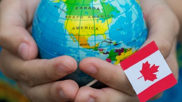 World globe and Canadian flag