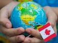 World globe and Canadian flag