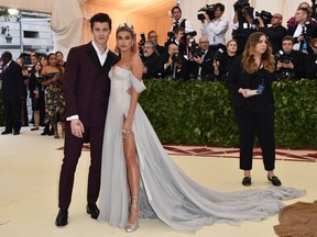 Hailey Baldwin (R) and Shawn Mendes arrive for the 2018 Met Gala on May 7, 2018,