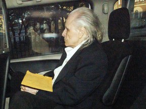 Peter Nygard leaves court in a car.
