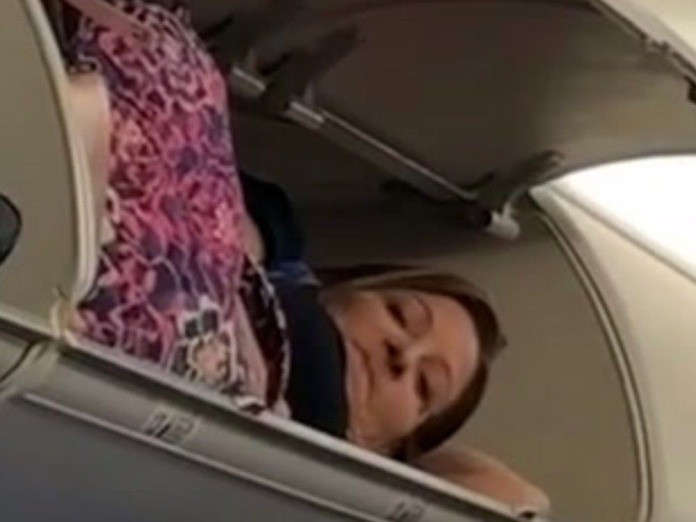 Woman tries to take a nap on a Southwest flight — in the overhead
bin, video shows