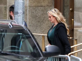 Stormy Daniels leaves a courthouse.