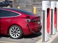 A Tesla car is being charged at the Tesla Supercharger station at King's Cross shopping mall in Kingston, Ontario on Tuesday, July 7, 2020.