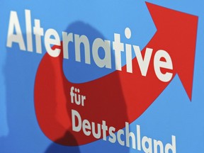 FILE -The Alternative for Germany (AfD) party logo is seen during a press conference after Germany's general election in Berlin, Monday, Sept. 23, 2013. German lawmakers have lifted the immunity from prosecution of one of the far-right Alternative for Germany party's top candidates in the upcoming European Parliament election as he faces an investigation.