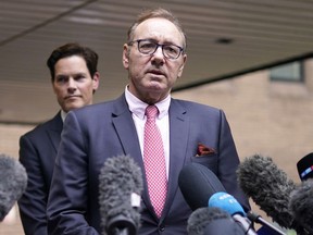 FILE - Actor Kevin Spacey addresses the media outside Southwark Crown Court in London, Wednesday, July 26, 2023. Spacey, the Oscar-winning actor, has denied new allegations of inappropriate behavior from men who will feature in a documentary on British television that is due to be released on May, 6-7, 2024.