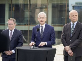 Norway's Prime Minister Jonas Gahr Støre, centre, Finance Minister Trygve Slagsvold Vedum, right and Defense Minister Bjørn Arild Gram, take part in a press conference on defense at SMK, in Oslo, Thursday, May 2, 2024. The Norwegian center-left government wants to add 7 billion kroner ($630 million) to the Scandinavian country's Armed Forces on top of the hefty increase of the defense budget announced last month.