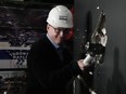 Keith Pelley, CEO of Maple Leaf Sports and Entertainment, swings a sledgehammer during a photo opportunity, as MLSE announces the second phase of Scotiabank Arena Reimagination project, in Toronto, on Tuesday, May 14, 2024.THE CANADIAN PRESS/Chris Young