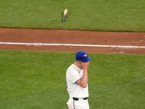 Toronto Blue Jays pitcher Chris Bassitt (40) reacts after giving up three runs to the Kansas City Royals during sixth inning American League MLB baseball action in Toronto, Wednesday, May 1, 2024.