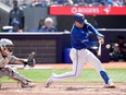 Toronto Blue Jays catcher Danny Jansen (9) hits an RBI double during third inning MLB baseball action against the Chicago White Sox, in Toronto, Monday, May 20, 2024.