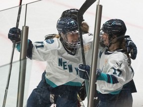 New York's Ella Shelton, right, celebrates her goal over Montreal with teammate Savannah Norcross (71) during second period PWHL hockey action in Montreal on Wednesday, April 24, 2024.