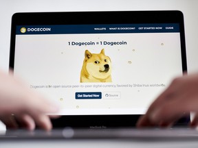 Dogecoin logo on laptop screen