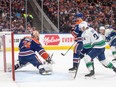 Vancouver Canucks' Pius Suter (24) watches the puck go in the net past Edmonton Oilers goalie Stuart Skinner (74) during first period second-round NHL playoff action in Edmonton on Sunday May 12, 2024.THE CANADIAN PRESS/Jason Franson