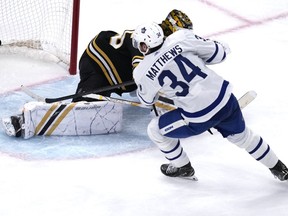Toronto Maple Leafs centre Auston Matthews (34) beats Boston Bruins goaltender Linus Ullmark, back, for a goal during the third period of Game 2 of an NHL hockey Stanley Cup first-round playoff series, in Boston, Monday, April 22, 2024.