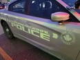 Police in the Greater Toronto Area say a man charged with fraud and money laundering, who called himself the "crypto king," tried to solicit investments as recently as February. A Durham Regional Police car is shown at a Bowmanville, Ont., shopping centre parking lot on Tuesday Feb. 28, 2023.