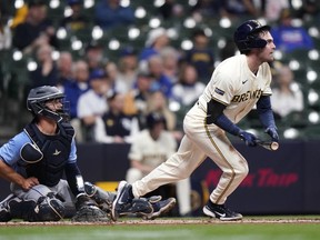 Tyler Black was at the plate in his big league debut with the Milwaukee Brewers as his father, former TSN broadcaster Rod Black, and his mother Nancy Black, were being interviewed in the stands. Black, right, watches after hitting a double for his first major league hit during the third inning of a baseball game against the Tampa Bay Rays, in Milwaukee, Tuesday, April 30, 2024.