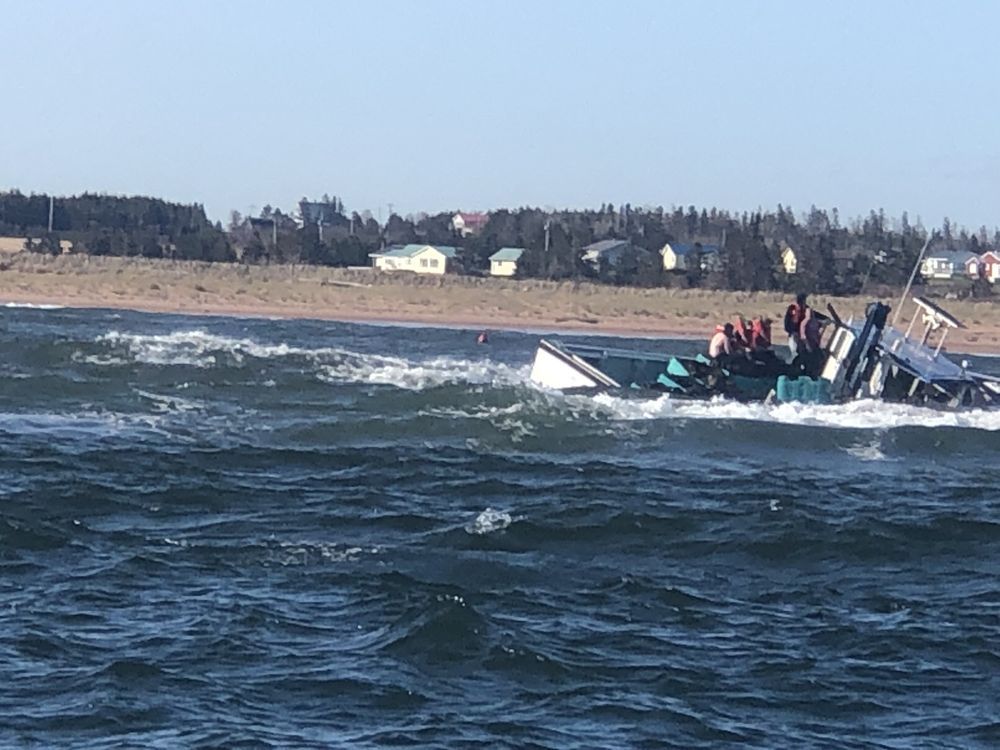 NextImg:Five crew rescued after mussel boat runs aground off Prince Edward Island
