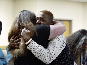 Eric Posey, of Post Falls, Idaho, embraces a supporter in court, after a jury awarded him more than $1.1 million in damages in his defamation lawsuit against conservative blogger Summer Bushnell, Friday, May 24, 2024, in Coeur D'Alene, Idaho. Posey said he suffered harassment and death threats after Bushnell falsely accused him of exposing himself to minors during a performance in 2022.