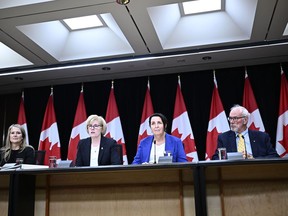 Minister of Sport and Physical Activity Carla Qualtrough, second from left, introduces Noni Classen, left, Justice Lise Maisonneuve, second from right, and Dr. Andrew Pipe at a news conference on the Future of Sport in Canada Commission, at the National Press Theatre in Ottawa, on Thursday, May 9, 2024.