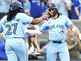 Toronto Blue Jays' Bo Bichette, right, celebrates his two-run home run against the Chicago White Sox with Vladimir Guerrero Jr. (27) during second inning MLB baseball action in Toronto on Wednesday, May 22, 2024.