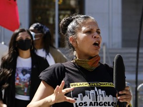 FILE - In this Aug. 5, 2020 file photo, Melina Abdullah speaks during a Black Lives Matter protest at the Hall of Justice in downtown Los Angeles. Abdullah on Thursday, May 23, 2024, lost her lawsuit against the city's police department over its handling of hoax calls that brought a large law enforcement response to her home four years ago.