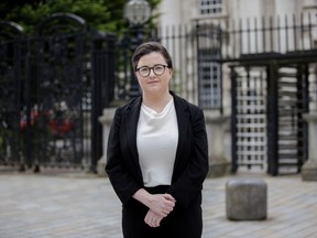 Sinead Marmion, asylum and immigration solicitor at Phoenix Law, poses outside Belfast High Court in Belfast, Monday May 13, 2024. The United Kingdom's law to deport asylum-seekers shouldn't apply in Northern Ireland because parts of it violate human rights protections, a Belfast judge ruled Monday. While the prime minister's office said the ruling wouldn't derail or delay Rwanda deportations it expects to begin in July, Sinead Marmion, a lawyer whose client prevailed in bringing the case said the law wouldn't apply in Northern Ireland.