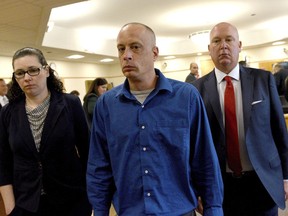Plaintiff David Meehan, center, leaves the courtroom with his attorney Rus Rilee, right, and victim specialist Joelle Wiggin during Meehan's trial at Rockingham Superior Court in Brentwood, N.H., April 10, 2024. The jury found the state liable for abuse at its youth detention center and awarded the sum to Meehan, a former resident who says he was beaten and raped as a teen.