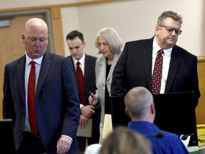 David Meehan sits in court as his attorneys Rus Rilee, left, and David Vicinanzo, right, along with state's attorneys Martha Gaythwaite and Brandon Chase return to the seats after a bench hearing with Superior Court Justice Andrew Schulman during Meehan's trial at Rockingham Superior Court in Brentwood, N.H., Wednesday, April 10, 2024.
