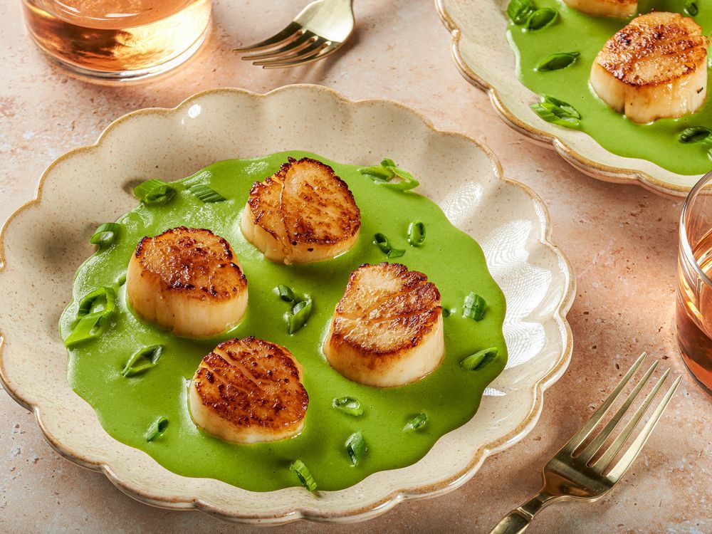 NextImg:Serve seared scallops on a creamy herb sauce for a quick, elegant meal