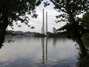 FILE - In this Aug. 7, 2019, photo, the Kingston Fossil Plant stands near a waterway in Kingston, Tenn. The nation's largest public utility is moving ahead with a plan for a new natural gas plant in Tennessee despite warnings that its environmental review of the project doesn't comply with federal law. The Environmental Protection Agency asked the Tennessee Valley Authority in a March 25, 2024 letter to redo several aspects of its environmental impact statement for converting the coal-burning Kingston Fossil Plant.