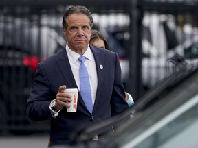 New York Gov. Andrew Cuomo prepares to board a helicopter, Aug. 10, 2021, in New York. A New York appeals court has ruled that a state commission tasked with investigating ethical violations was created unconstitutionally, a ruling that could strip the watchdog agency of its enforcement powers. The Thursday, May 9, 2024 ruling stems from a lawsuit filed by former Gov. Andrew Cuomo.