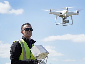 FILE - Michael Jones operates his drone, April 2, 2021, in Goldsboro, N.C. A North Carolina board that regulates land surveyors didn't violate the drone photography pilot's constitutional rights when it told him to stop advertising and offering aerial map services because he lacked a state license, a federal appeals court ruled on Monday, May 20, 2024.