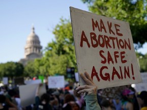FILE - Demonstrators march and gather near the Texas Capitol following the U.S. Supreme Court's decision to overturn Roe v. Wade, June 24, 2022, in Austin, Texas. A Texas man is petitioning a court to use an obscure legal action to find out who helped his former partner in an alleged out-of-state abortion, setting up the latest test to the limits of statewide abortion bans.