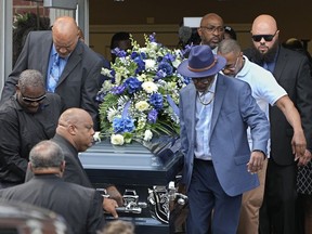 Pallbearers carry the casket of Frank Tyson out of Hear The Word Ministries church following funeral services Wednesday, May 8, 2024, in Canton, Ohio. Tyson, a 53-year-old Black man, died April 18 after he was handcuffed and left facedown on the floor of a social club while telling officers he couldn't breathe. (AP Photo)