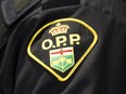 Three people are dead and five others injured after a speed boat and a fishing boat collided Saturday night on Bobs Lake north of Kingston, Ont. An Ontario Provincial Police logo is shown during a press conference in Barrie, Ont., Wednesday, April 3, 2019.