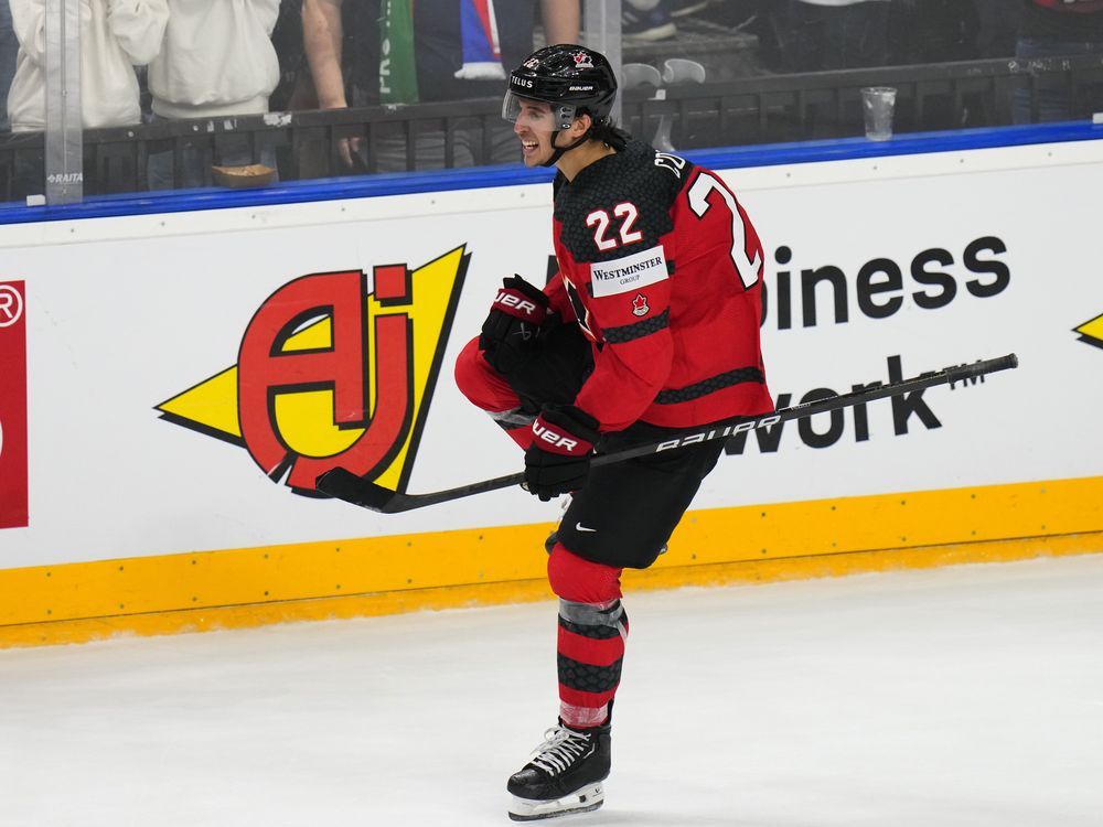 NextImg:Cozens scores second of game in OT as Canada outlasts Czechia at hockey worlds