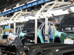 A Japanese company has announced that it will build an approximately $1.6-billion plant in Ontario's Niagara Region that will make a key electric vehicle battery component as part of Honda's supply chain in the province. Honda employees work along the vehicle assembly line in Alliston, Ont., on Thursday, April 25, 2024.