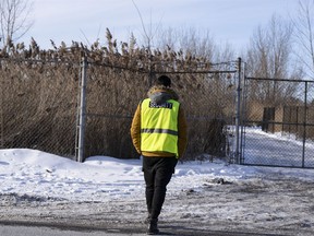 Security guards the entrance to the construction site of the new EV battery plant, Northvolt, in Saint-Basile-le-Grand, east of Montreal, Quebec, Friday, Jan. 19, 2024. The company behind the project for a major plant for electric vehicle batteries in Quebec says 'homemade bombs' were found at the construction site east of Montreal.
