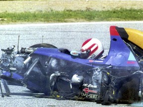 FILE - Austrian driver Roland Ratzenberger sits unconcious in his Simtek Ford after he crashed during the qualifying session for the Marino F 1 Grand prix in Imola Saturday April 30, 1994. Ratzenberger died later. The 30th anniversary of three-time F1 champion Ayrton Senna's death is being commemorated with a memorial on the Imola track where he crashed during the 1994 San Marino Grand Prix. Formula One CEO Stefano Domenicali is to be joined Wednesday, May 1, 2024, by politicians from Brazil and Italy, plus a representative from Austria to also recall fellow Formula One driver Roland Ratzenberger, who died a day earlier during qualifying. (AP Photo, File)